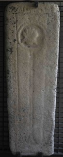 Tombstone with cord and scallop, Franciscan symbols