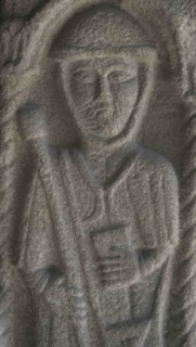 Bas-relief sculpture depicting a pilgrim