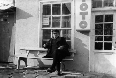 A man sitting on a bench.