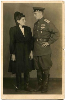 A military pilot who was awarded the Order of the Red Banner, and three medals and a young woman.