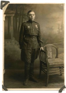 Soviet Army sergeant with a medal For the Victory in Great Patriotic War and the sign Guard on his chest.