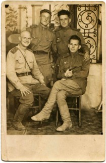 Four smiling officers of the Red Army.