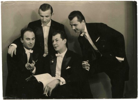 Cabinet photo of four men in evening dress.
