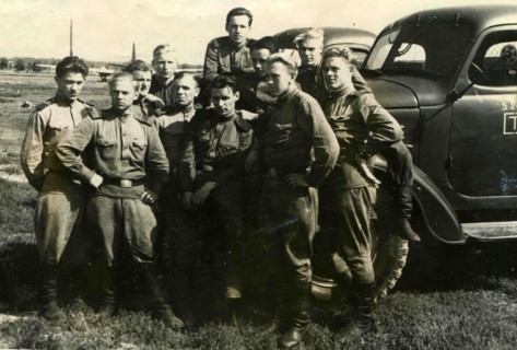Soviet soldiers against the truck.