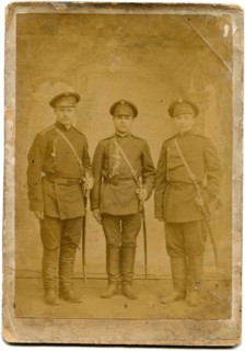 Three soldiers with swords.
