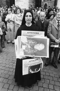 Vatican City, a nun with newspapers announcing the pontificate of John Paul II