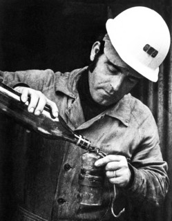Miner loads the acetylene lamp, Iglesias, Sardinia, Italy 1970