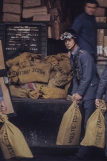 Sacks of poste italiane in railway station, milan, italy, 70's