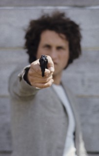 Man with gun, 70's