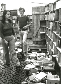 Young people in a used books store, milan, 60's
