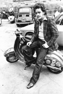 Man sitting on a vespa, naples, 70's