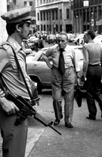 Policeman with a handgun in a street of naples, italy, 80's