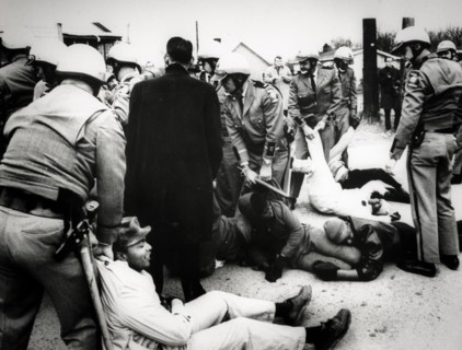 Troopers drag demonstrators to prison buses after about 60 persons laid down in the street to block a school bus from going to the all-negro social circle training school, georgia, 1968
