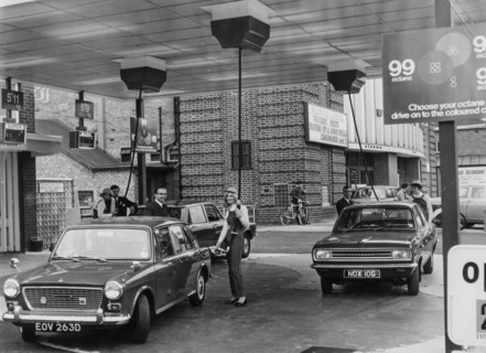 Service station with fuel pumps that descend from above, birmingham, england, uk, 1968
