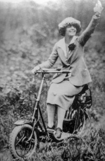 Woman on scooter, 50s