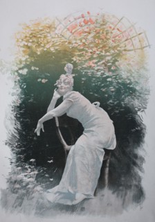 Woman Sitting On A Chair In The Garden And Enjoying The Sunshine