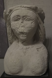 Female stone bust.
