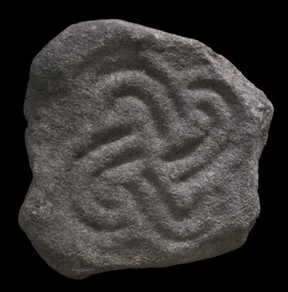 Architectural element depicting a tetraskelion.