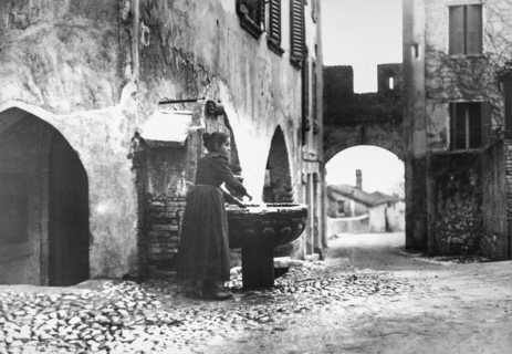 Woman Washing Hands In Fountain.