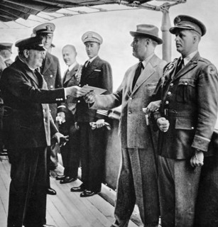 A letter from His Majesty the King being presented to Mr President Roosevelt by Mr Churchill.