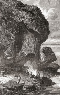 Neanderthal man under the rock shelter of the Bruniquel Cave, France in prehistoric times.