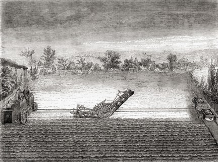 A steam driven traction engine and a multi bladed plough designed by John Fowler in the 19th century.