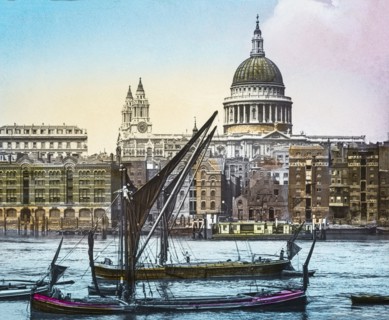 St Paul's cathedral from the Thames with sailing boats near St Paul's Pier.