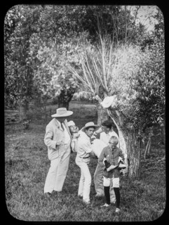 A master and children carrying a child for first aid assistance.