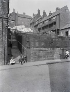 A street in Whitby, Yorkshire with four children.