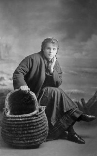 A portrait of a fisherlass with her basket.