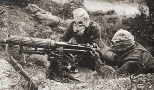 Two soldiers wearing respirators to protect them from poison gas during WWI.