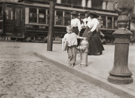 Child newspaper vendor.
