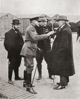 M. Albert Thomas, French Minister of Munitions, Sir Douglas Haig and General Joffre in conversation with Mr. Lloyd George.