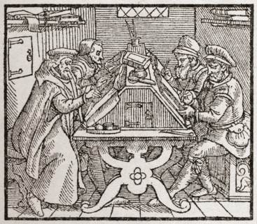 Scribes at work during the Tudor period in England.
