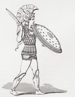 Helmeted Greek Warrior Wearing Greaves And Armour Holding A Clipeus Shield And Sword.