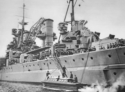 The King spends three days aboard the King George V, his majesty descending the gangway to his barge.