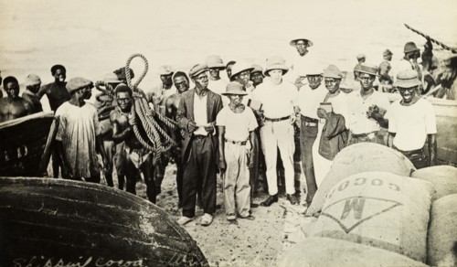 Mr Tamlin and workers on the beach