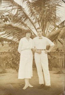 Mr and Mrs Tamlin in the shade of a palm tree