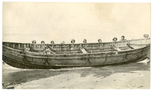 Wooden boat at water's edge