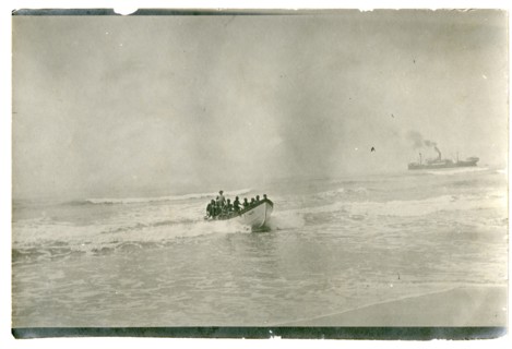 Rowing boat off the coast