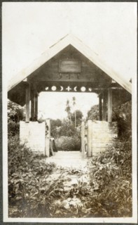 Gateway with wooden cross