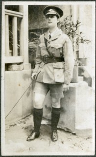 Portrait of European woman dressed up in army uniform