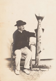 European man posing with a fish