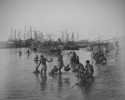 Sampan fishing boats and Indian water-carriers, Calcutta