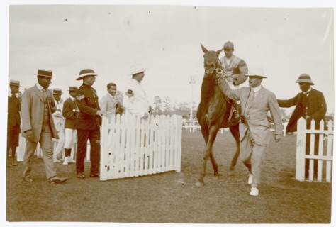 Group of men with jockey on horse, Colombo