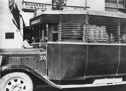 A Jewish bus in Palestine with protective covering on the outside to protect bus riders.