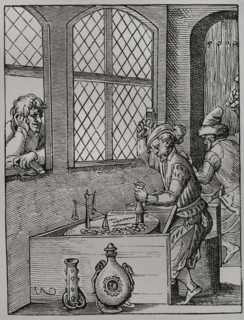 Making of coins. Facsimile of an engraving by Jost Amman in 1659. Sciences & Lettres au Moyen Age