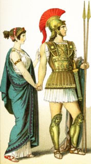 The figures represent two ancient Greeks: a woman of the upper class and her husband, a commander