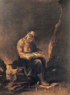 An old witch sits on a rock and reads in a magic book. Around her feet a magic circle of candles,