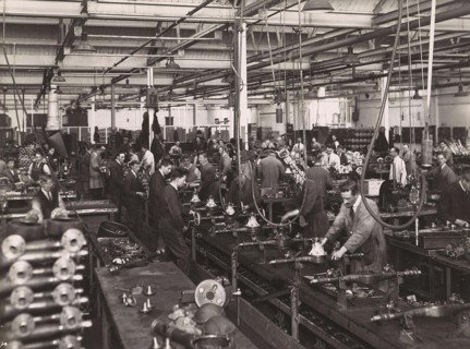 Wolseley factory interior with workers at machinery, Wolseley Motor Company was a British car